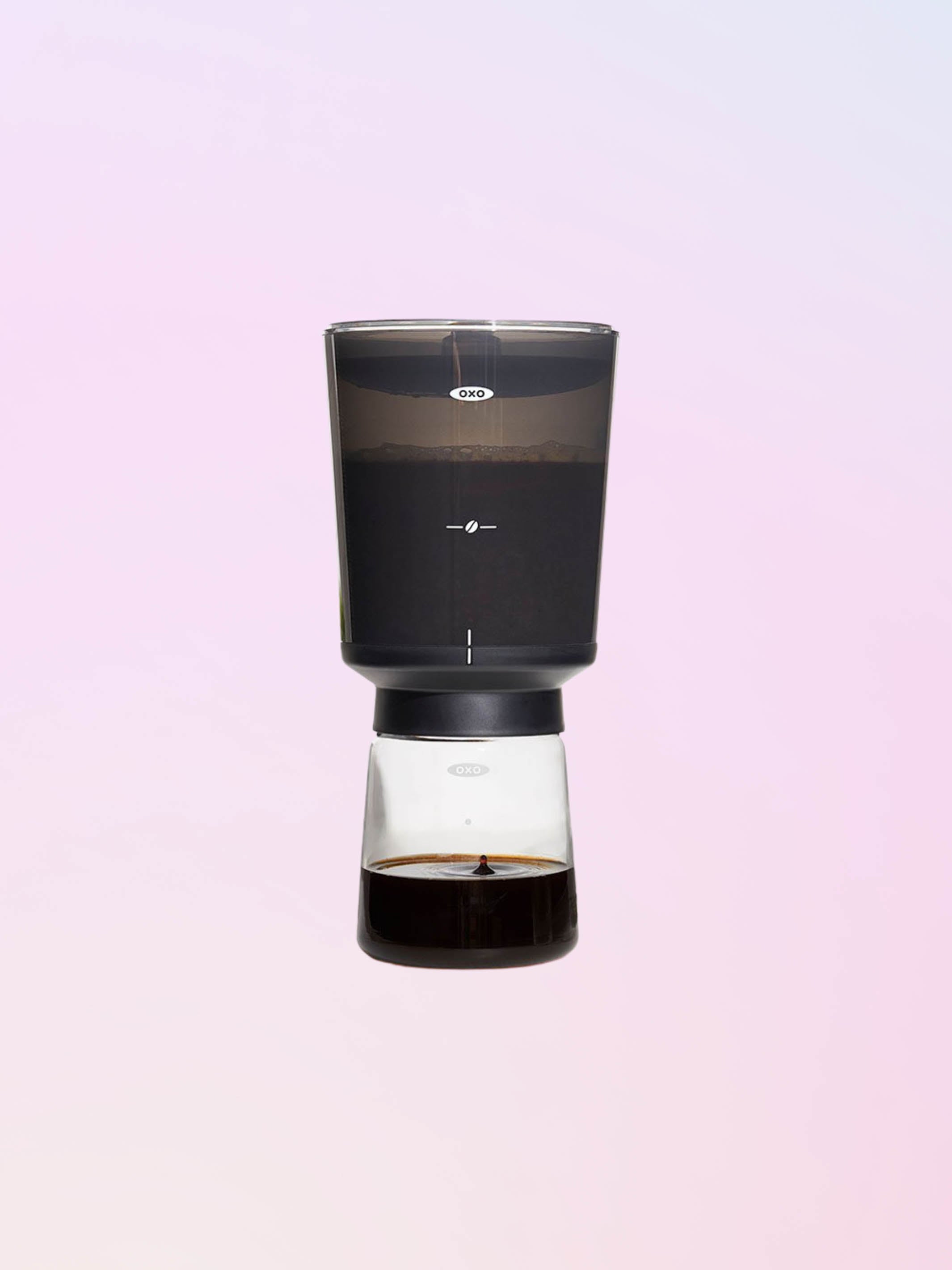 Coffee brewing in a OXO compact coffee cold brewer and finished cold brew in the bottom carafe..