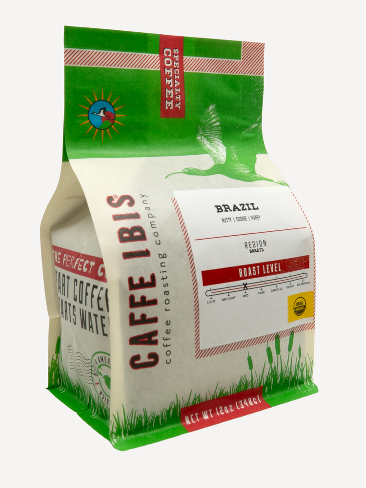 Caffe Ibis' organic Brazil coffee in a green twelve ounce bag, front quarter view.