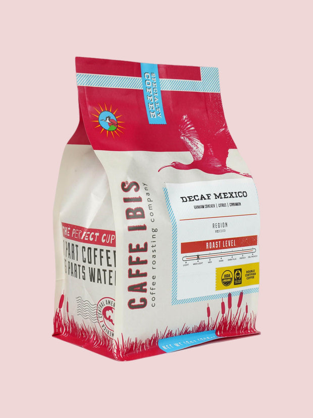 Caffe Ibis Decaf Organic Mexico coffee in a red twelve ounce bag; front quarter view.