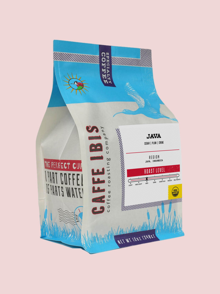 Caffe Ibis Organic Java coffee in a blue twelve ounce bag; front quarter view.