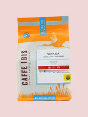 Caffe Ibis Organic Worka in an orange twelve ounce bag; front view.
