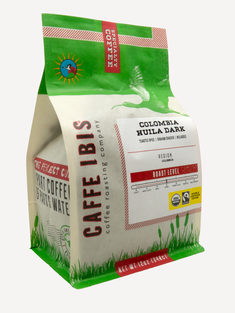 Caffe Ibis Organic Colombia Huila Dark coffee in a green twelve ounce bag; front quarter view.