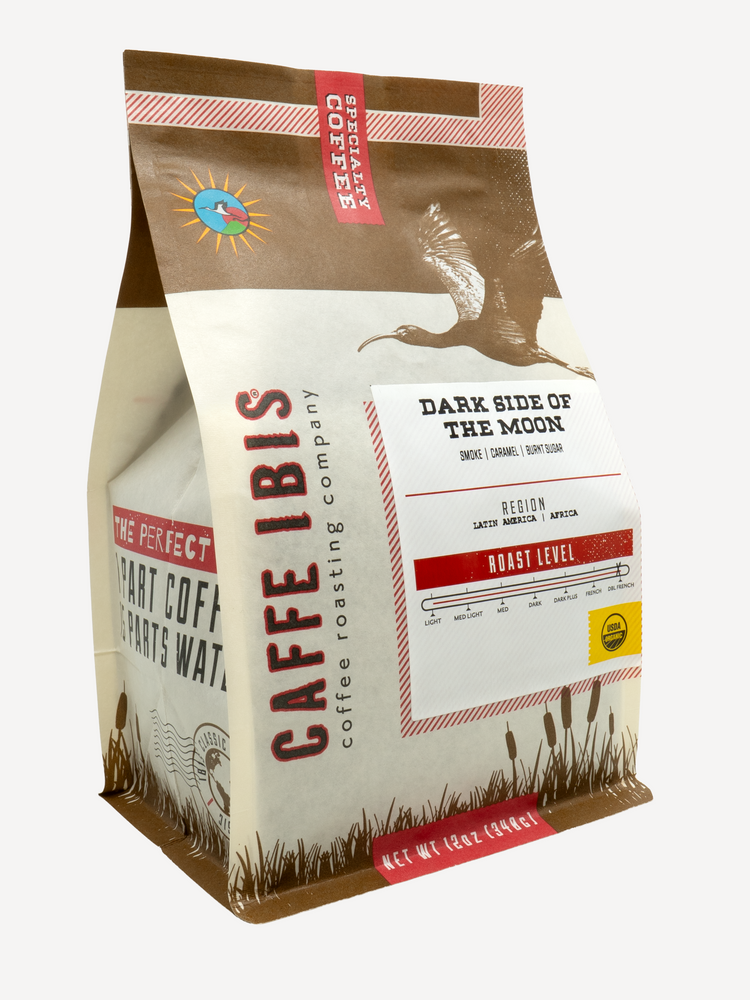 Caffe Ibis Organic Dark Side of the Moon coffee in a brown twelve ounce bag; front quarter view.