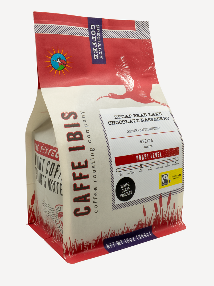 Caffe Ibis Decaf Bear Lake Chocolate Raspberry flavored coffee in a red twelve ounce bag; front quarter view.