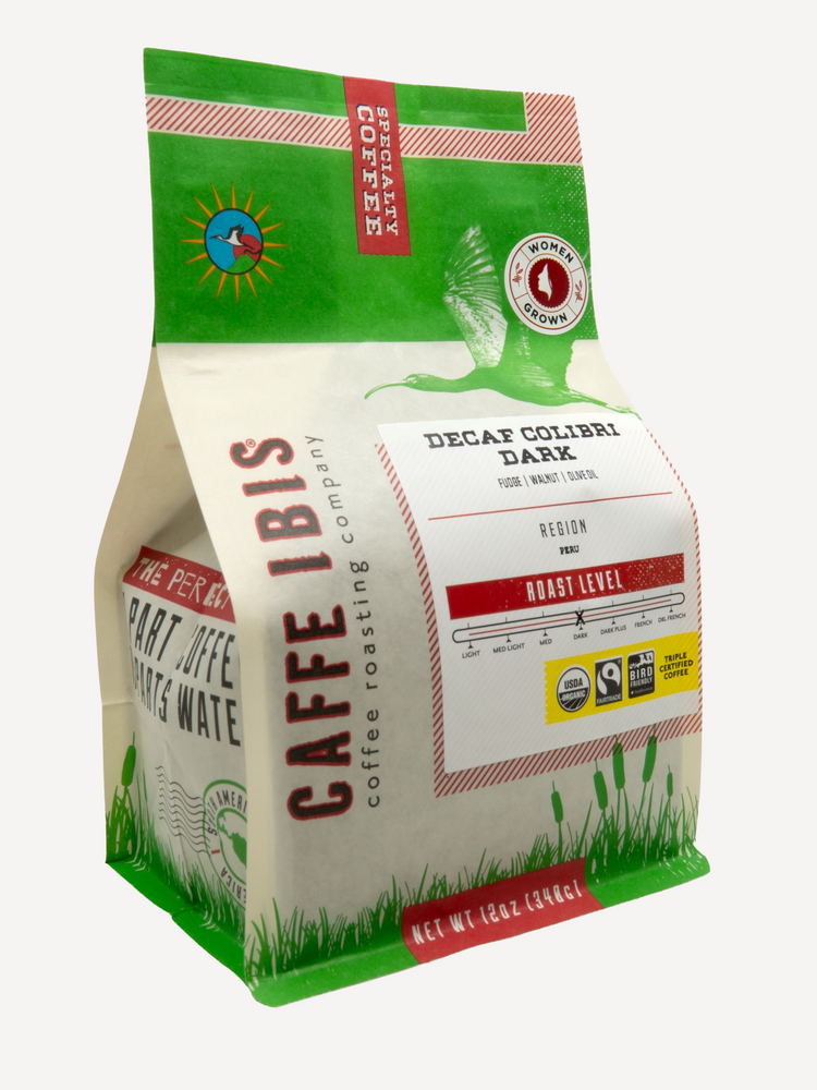 Caffe Ibis Organic Decaf Colibri Dark in a green twelve ounce bag; front quarter view.