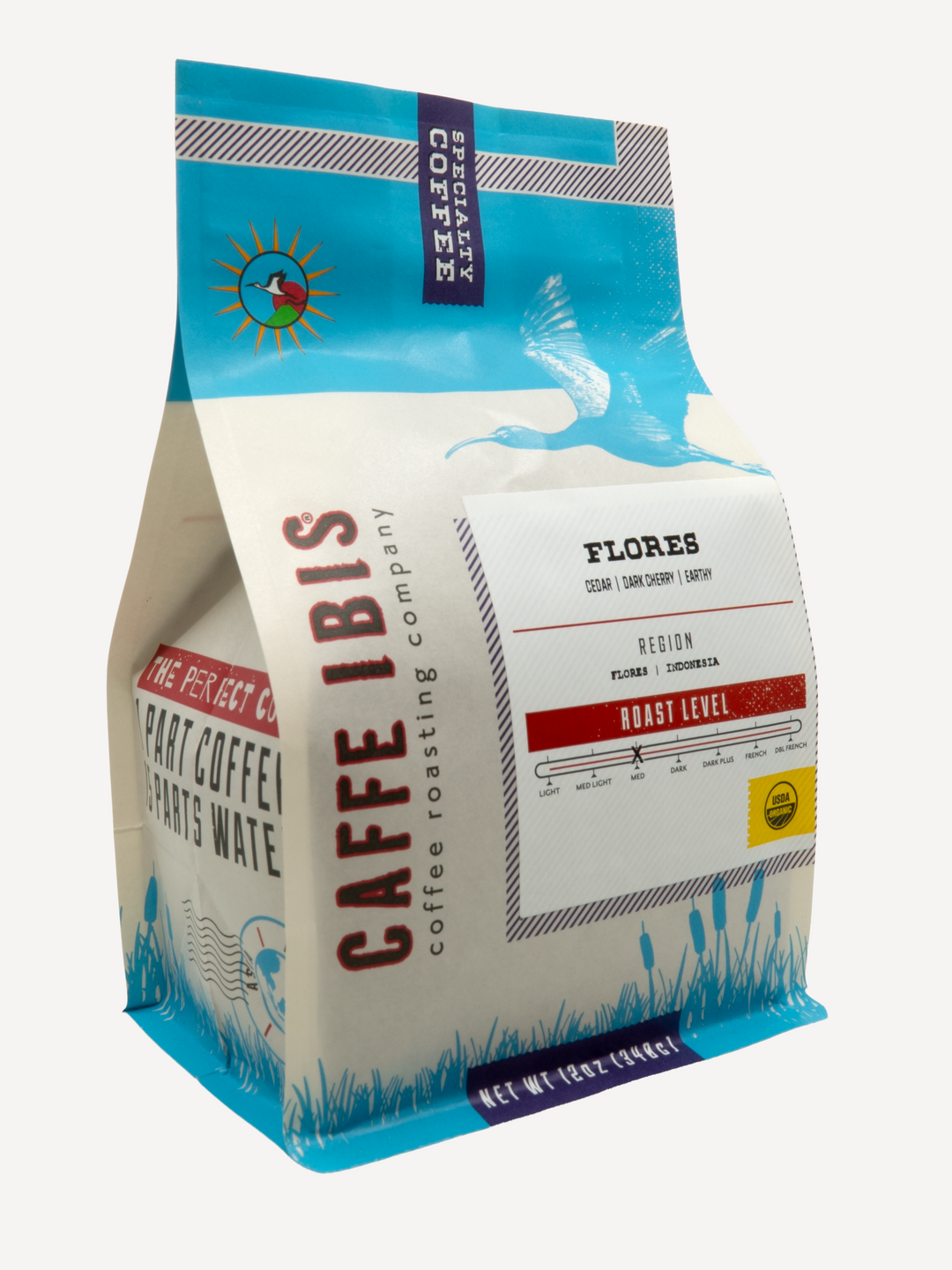Caffe Ibis Organic Flores in a blue twelve ounce bag; front quarter view.