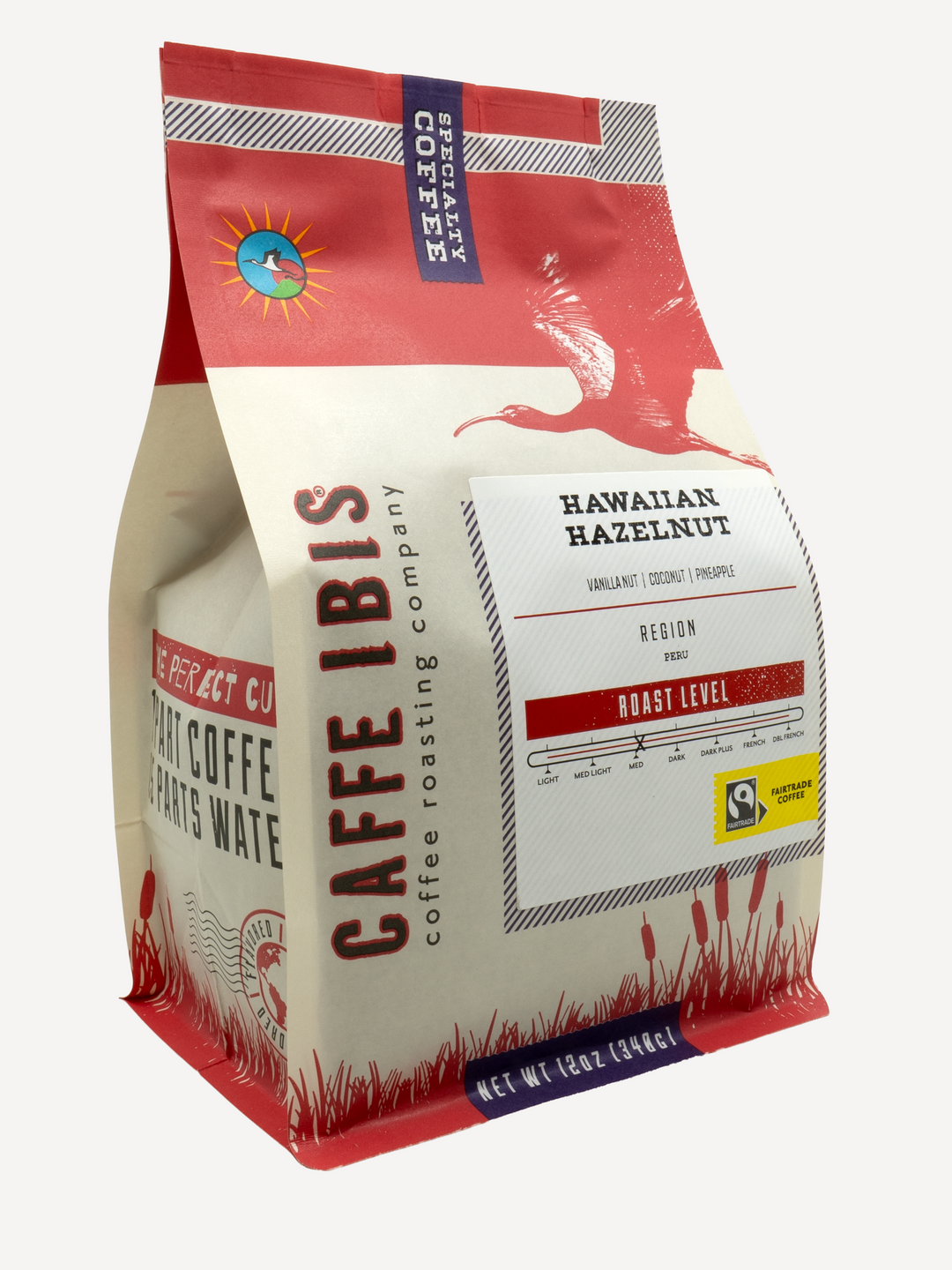 Caffe Ibis flavored Hawaiian Hazelnut coffee in a red twelve ounce bag; front quarter view.