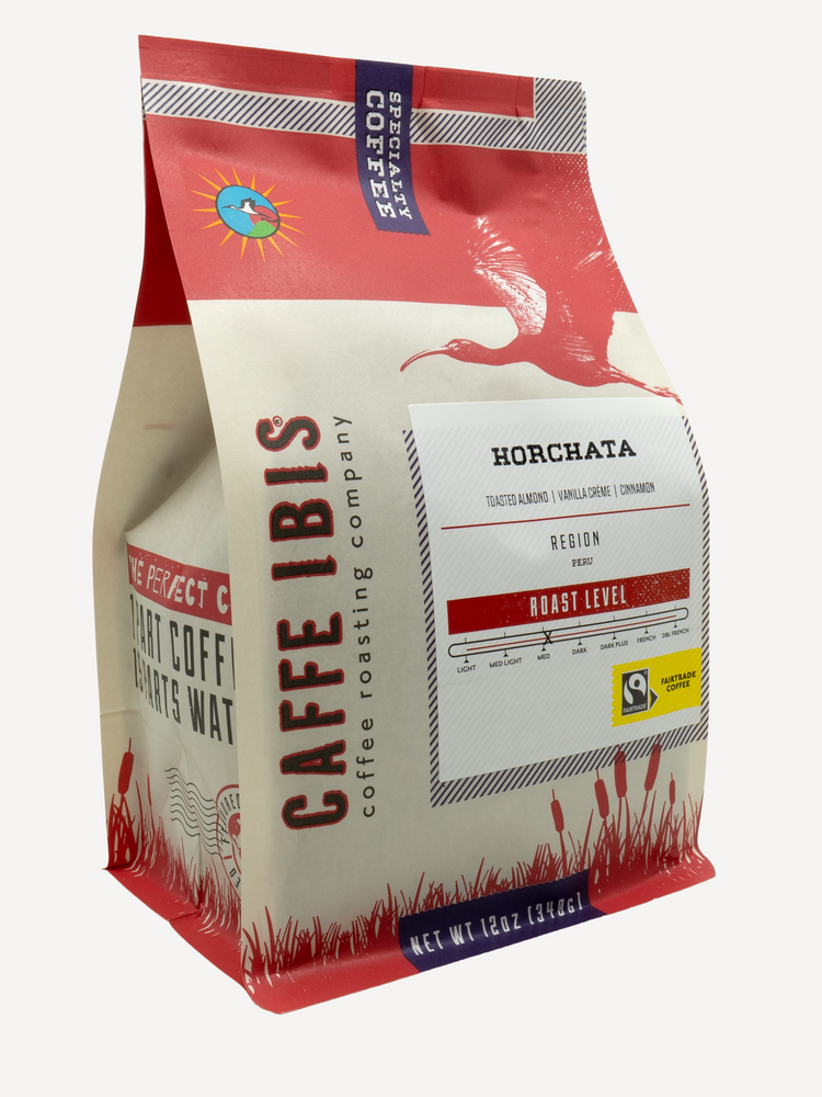 Caffe Ibis flavored Horchata coffee in a red twelve ounce bag; front quarter view.