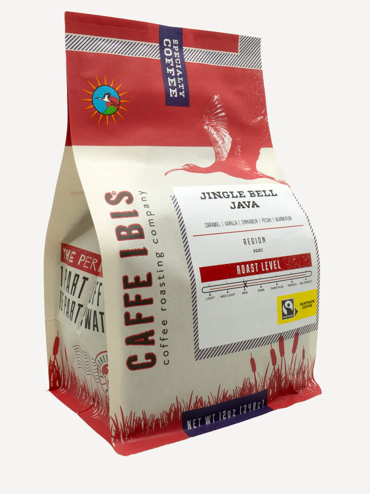 Caffe Ibis seasonal flavored Jingle Bell Java coffee in a red twelve ounce bag; front quarter view.