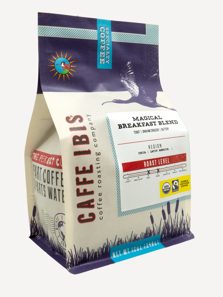 Caffe Ibis Organic Magical Breakfast Blend in a purple twelve ounce bag; front quarter view.