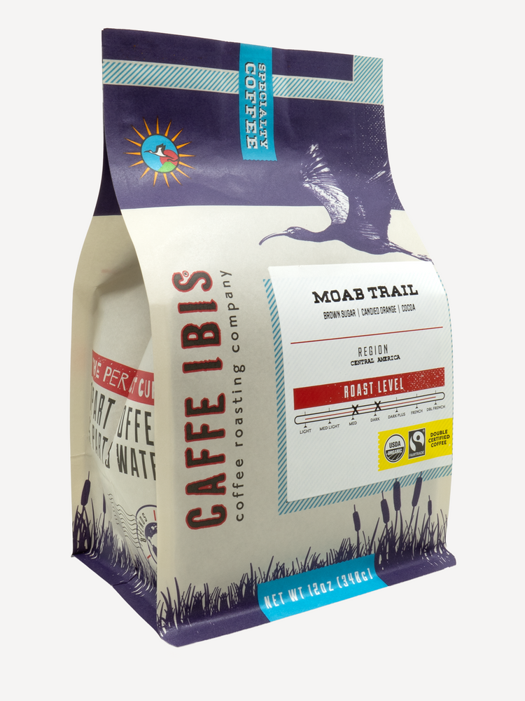 Caffe Ibis Organic Moab Trail coffee in a purple twelve ounce bag; front quarter view.