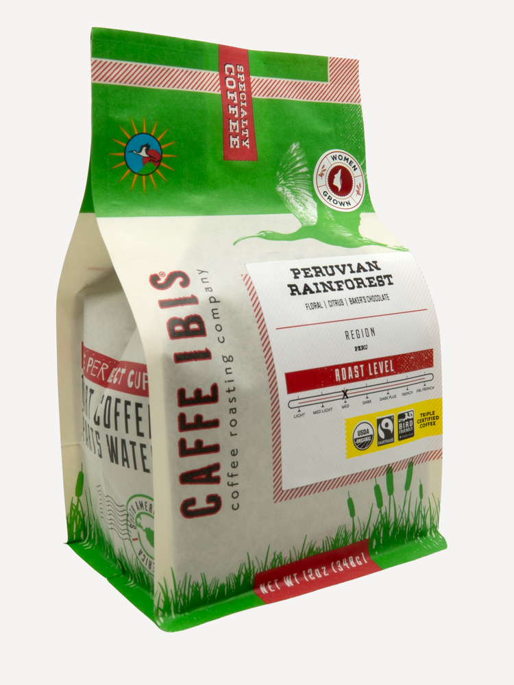 Caffe Ibis Organic Peruvian Rainforest in a green twelve ounce bag; front quarter view.
