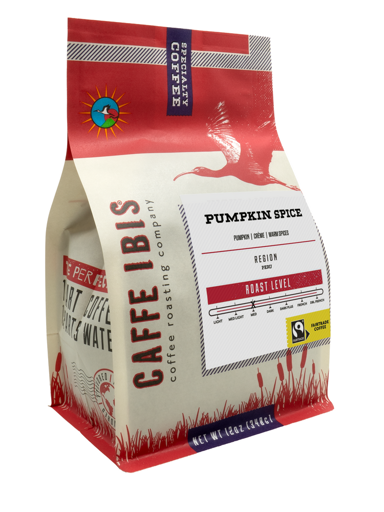 Caffe Ibis seasonal flavored Pumpkin Spice coffee in a red twelve ounce bag; front quarter view.