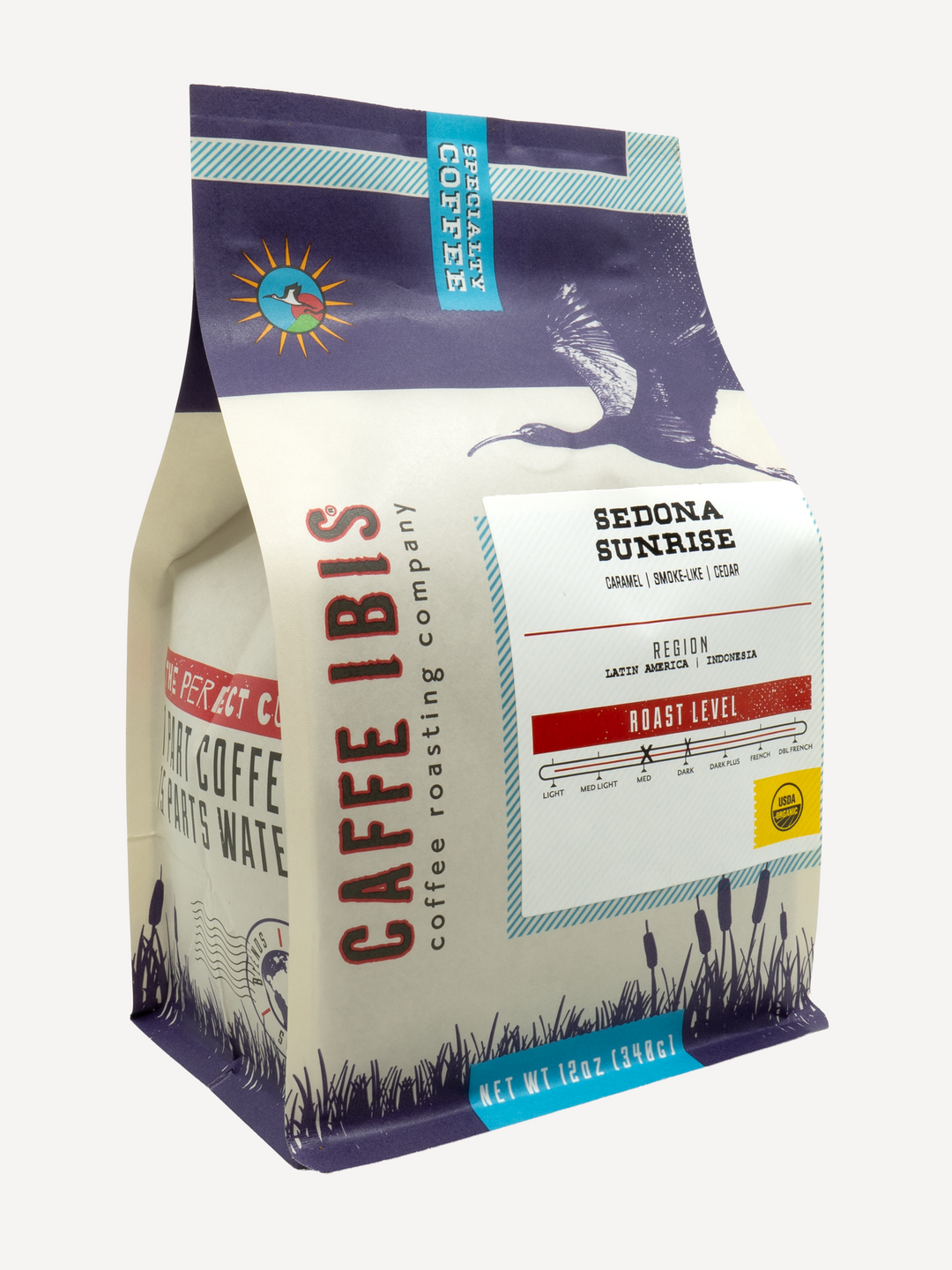 Caffe Ibis Organic Sedona Sunrise coffee in a purple twelve ounce bag; front quarter view.