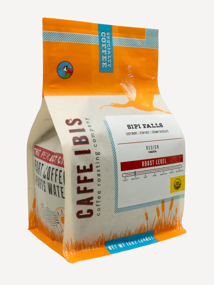 Caffe Ibis Organic Sipi Falls coffee in an orange twelve ounce bag; front quarter view.