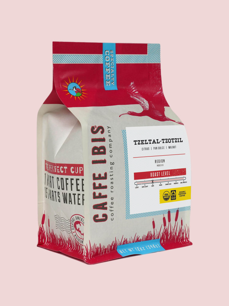 Caffe Ibis Organic Tzeltal-Tzotzil in a red twelve ounce bag; front quarter view.