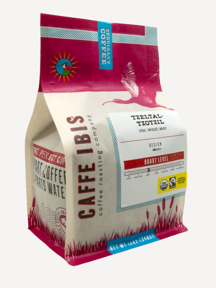 Caffe Ibis Organic Tzeltal-Tzotzil in a pink twelve ounce bag; front quarter view.