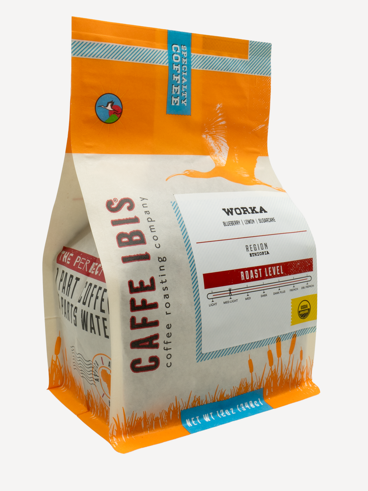 Caffe Ibis Organic Worka in an Orange twelve ounce bag; front quarter view.