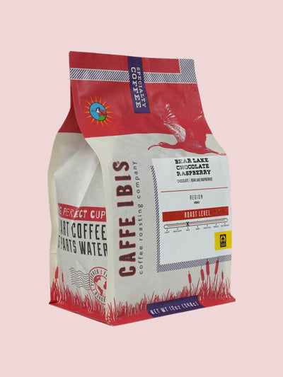 Caffe Ibis Bear Lake Chocolate Raspberry flavored coffee in a brown twelve ounce bag; front quarter view.