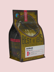 Caffe Ibis Korak in a Best of Ibis twelve ounce bag; front quarter view.