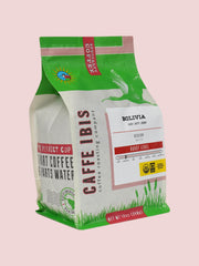Caffe Ibis organic Bolivia coffee in a green twelve ounce bag; front quarter view.