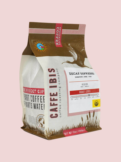 Caffe Ibis Organic Decaf Espresso coffee in a brown twelve ounce bag; front quarter view.