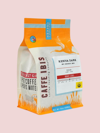 Caffe Ibis Organic Kenya Dark coffee in an orange twelve ounce bag; front quarter view.