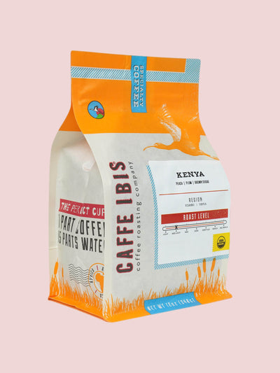 Caffe Ibis Organic Kenya coffee in an orange twelve ounce bag; front quarter view.