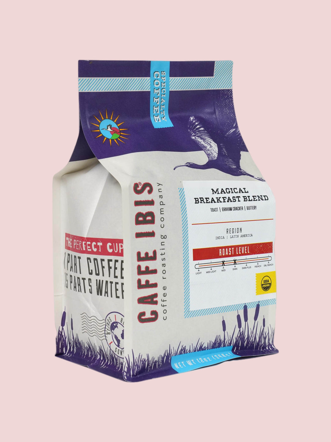 Caffe Ibis Organic Magical Breakfast Blend in a purple twelve ounce bag; front quarter view.