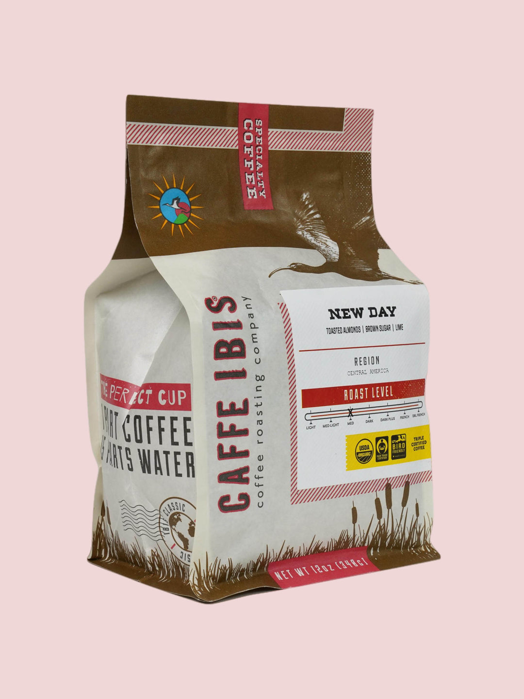 Caffe Ibis Organic New Day coffee in a brown twelve ounce bag; front quarter view.