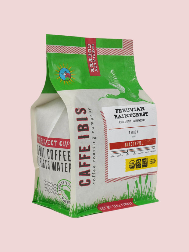 Caffe Ibis Organic Peruvian Rainforest in a green twelve ounce bag; front quarter view.