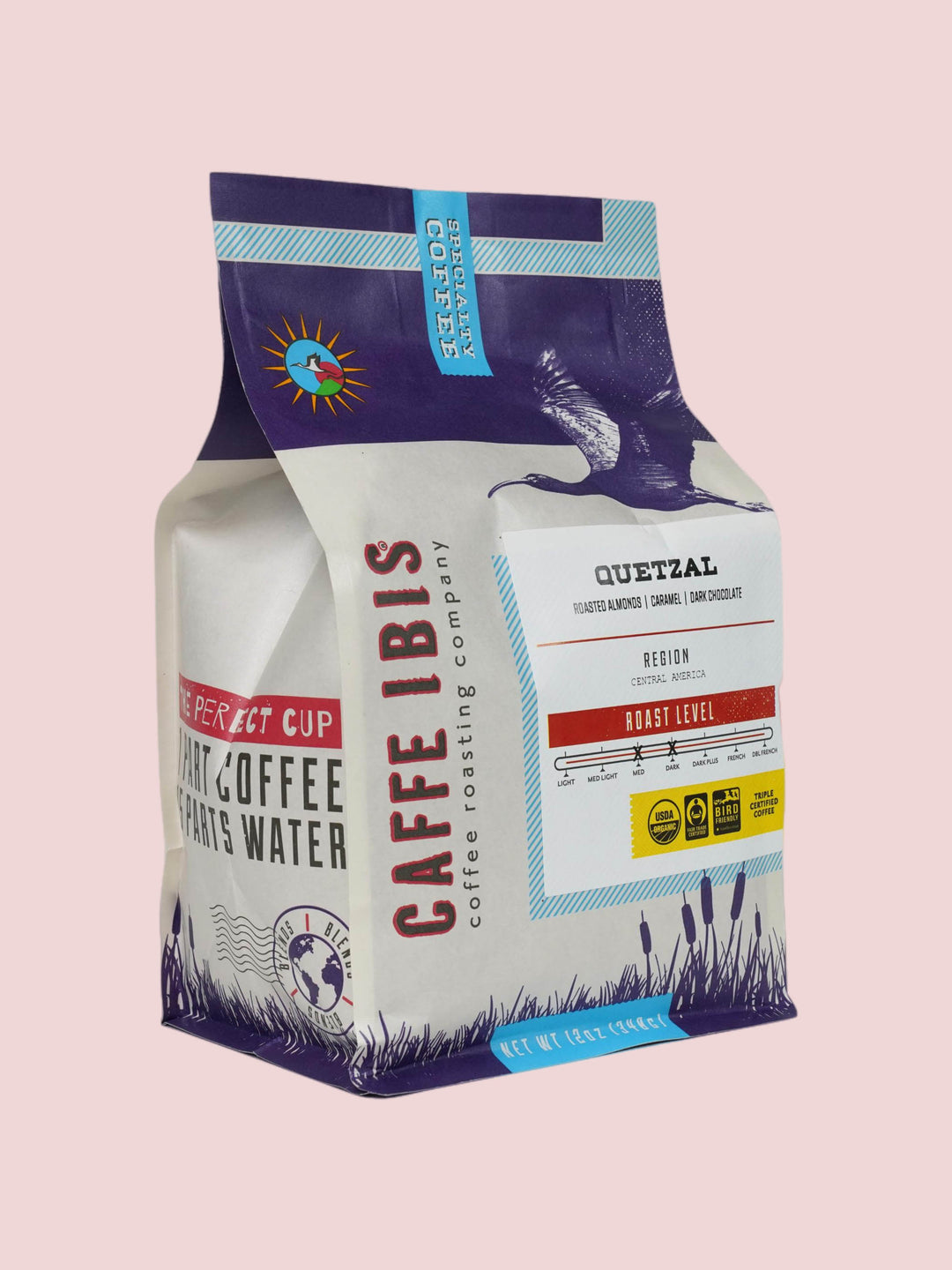 Caffe Ibis Organic Quetzal coffee in a purple twelve ounce bag; front quarter view.