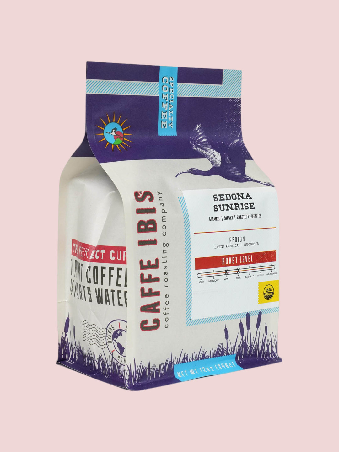 Caffe Ibis Organic Sedona Sunrise coffee in a purple twelve ounce bag; front quarter view.