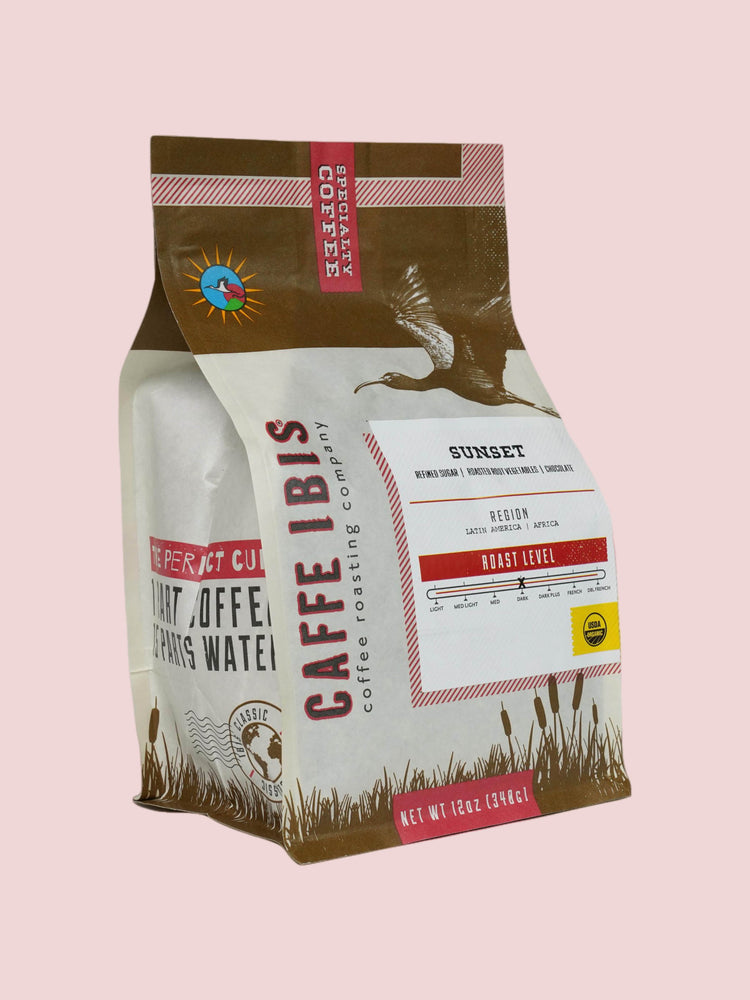Caffe Ibis organic sunset blend coffee in a brown twelve ounce bag; front quarter view.