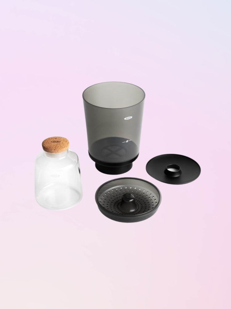 Pieces displayed of the four main components of the OXO compact cold brewr.